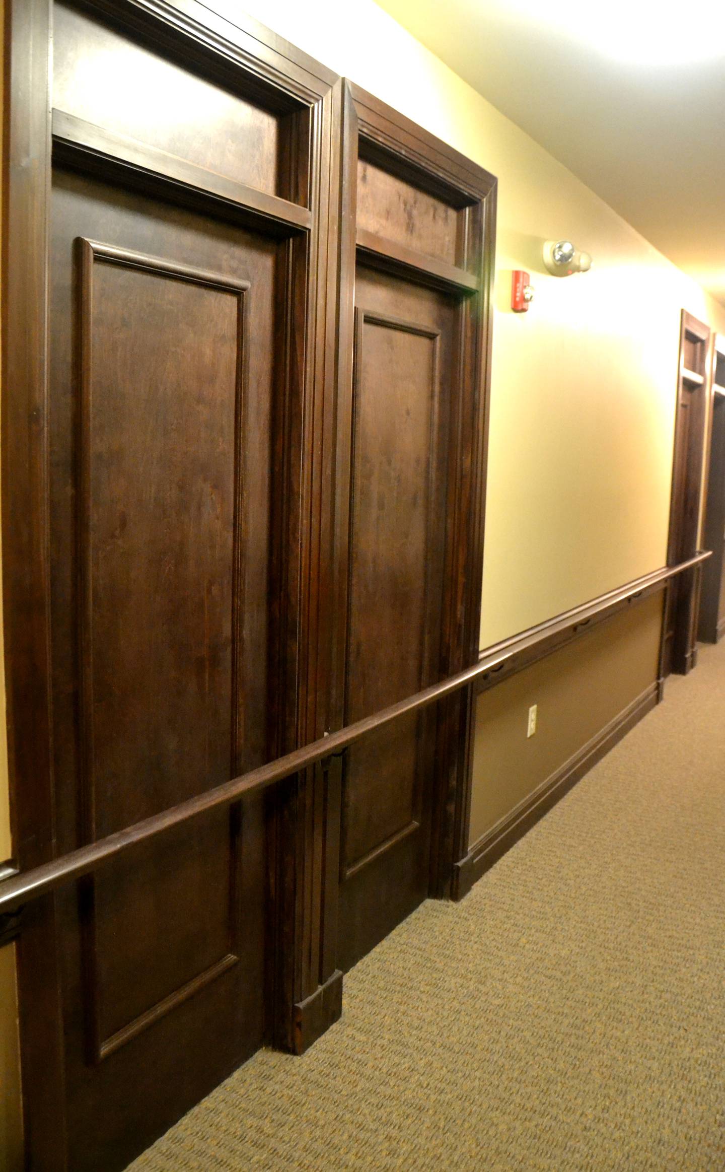 The original hotel room doors are still visible in the building's hallways.