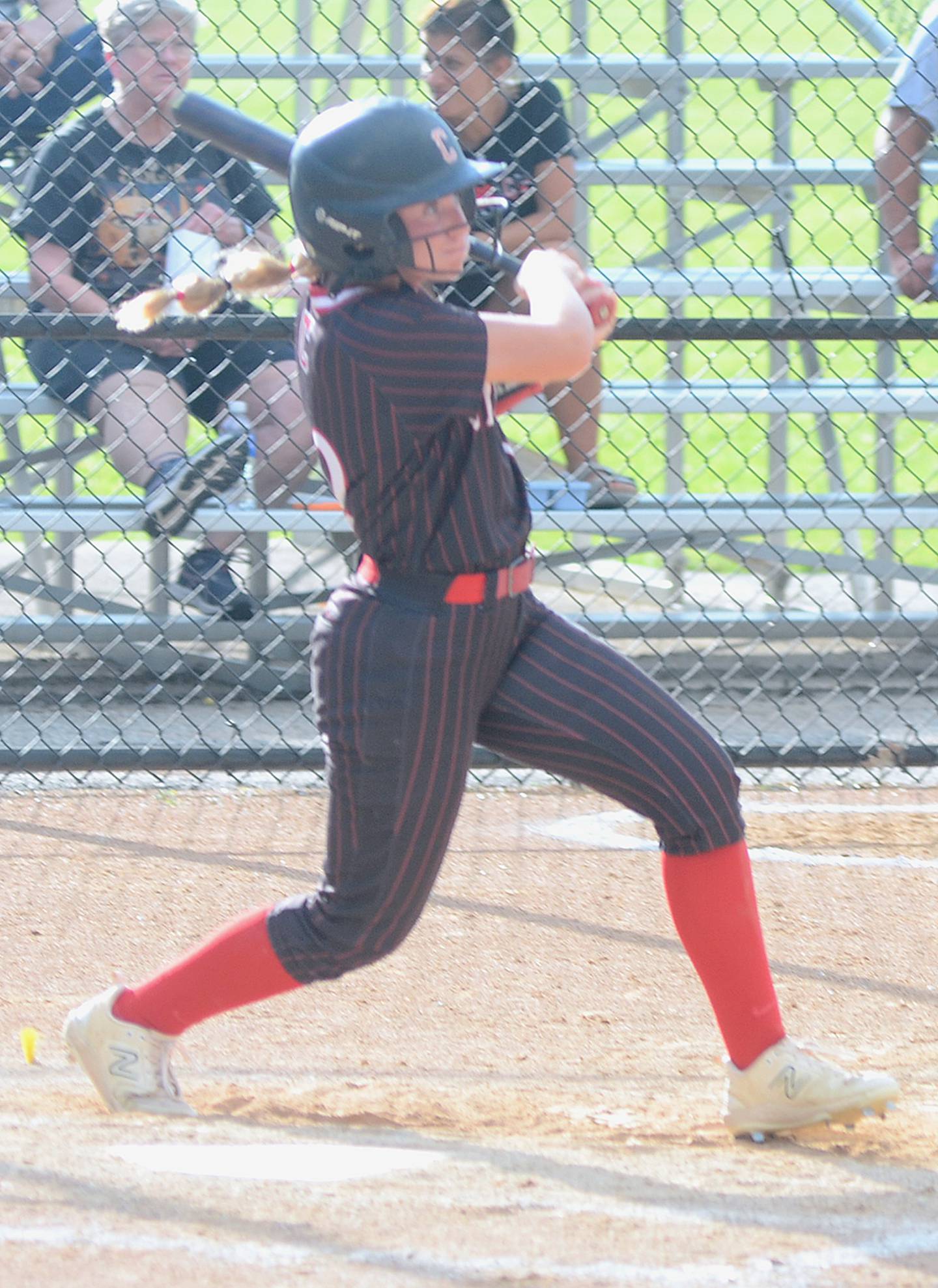 Sasha Wurster watches her run-scoring double soar to the outfield in Monday's opener against St. Albert. The Panther right fielder had three hits, including two doubles, and three RBIs in the doubleheader sweep.