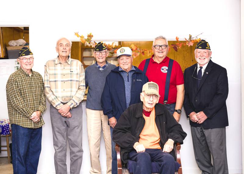 Veterans at a quilt presentation by the Red, White and Blue Quilt Guild of Greenfield are from left, Larry Riley, Chuck Standley, Jack Brown, Larry Woosley, Gary Firch (sitting), Galen Schwochow and Gary Handley. Receiving quilts were Firch, Standley and Schwochow.