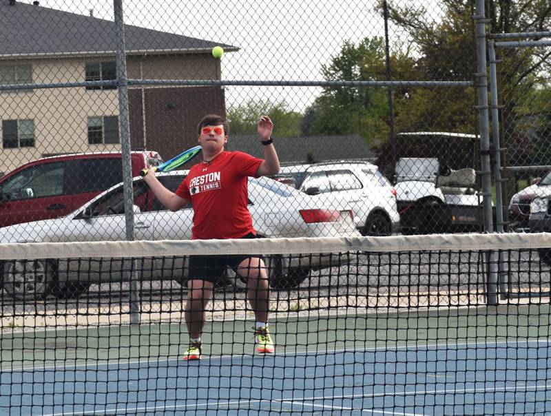 Creston senior Malachi Webber returns a serve Friday against Clarinda.