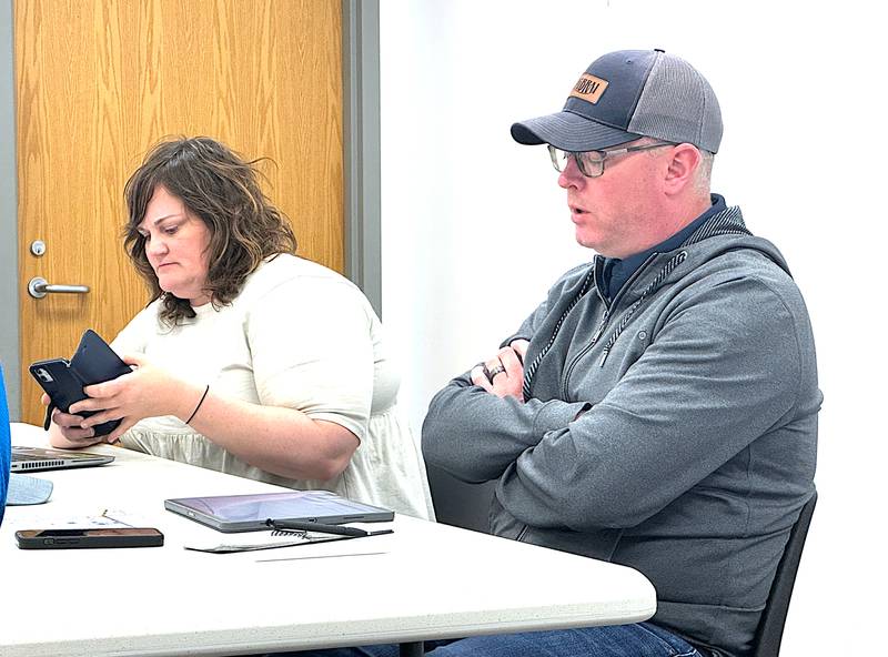 RAGBRAI director Matt Phippen and director of the cycling division, Anne Lawrie, talk with Greenfield and Adair County leaders during a stop here in April.