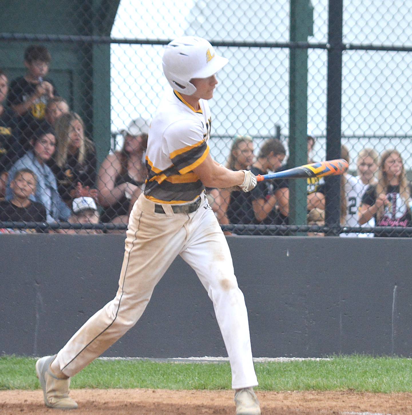 Lenox's Gabe Funk watches one of his RBI singles leave his bat Saturday night in a district final against Mount Ayr. Funk went 3-for-4, including a double, a stolen base, a run scored and two RBIs.