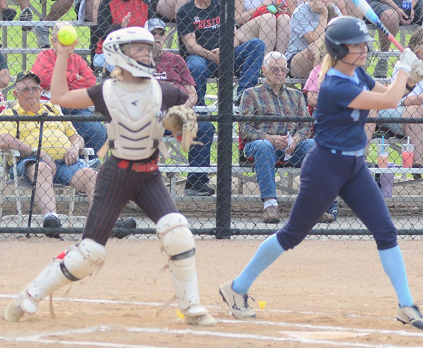 Creston catcher throws to second baseman Avery Staver for the third out of the first inning on a Lewis Central stolen base attempt.