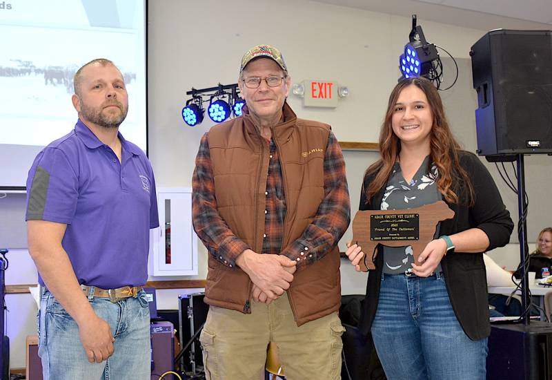 Drs. Gary Schulteis (middle) and Melissa Garcia Rodriguez (right) of Adair County Veterinary Clinic receive the Friend of the Cattlemen Award on behalf of the staff at their practice from Adair County Cattlemen President Tyson Edwards (left).
