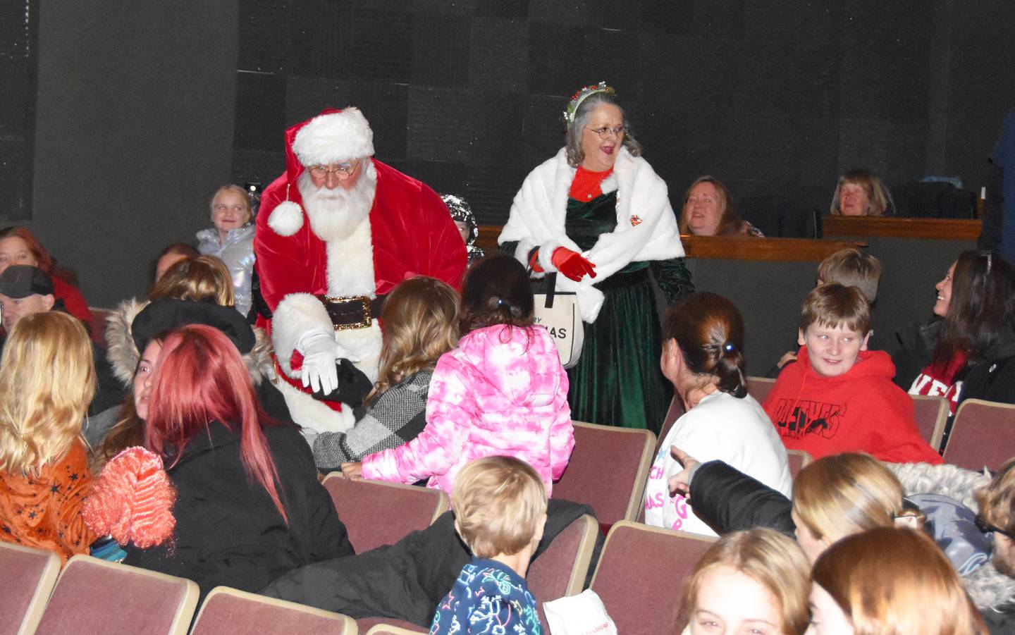 Santa and Mrs. Claus say hello following a showing of "The Polar Express" during Merry Marketplace.