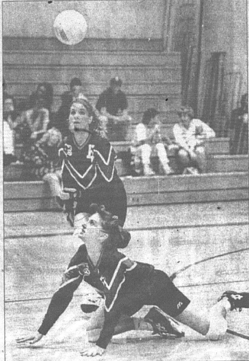 Creston's Jessica Beving looks up after a diving dig as teammate Katie Turner moves in during Tuesday's home finale against Kuemper.