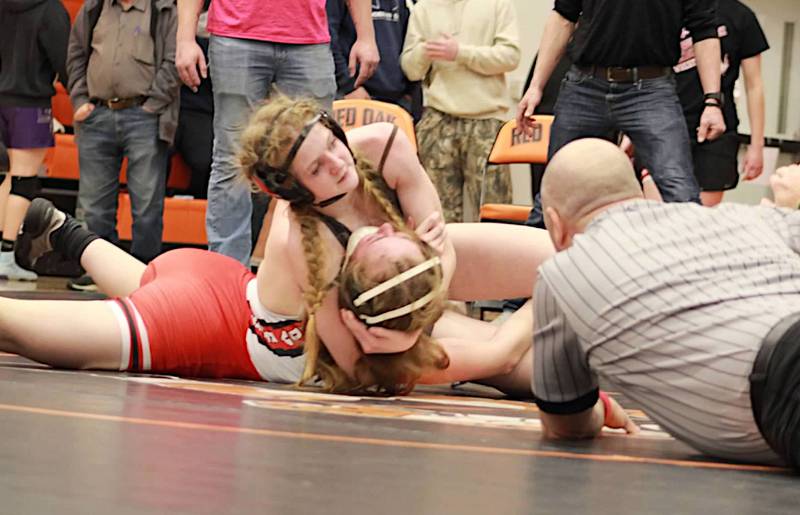 SWAT wrestler Destiny Fry pins an opponent of hers in the regional tournament at Red oak.