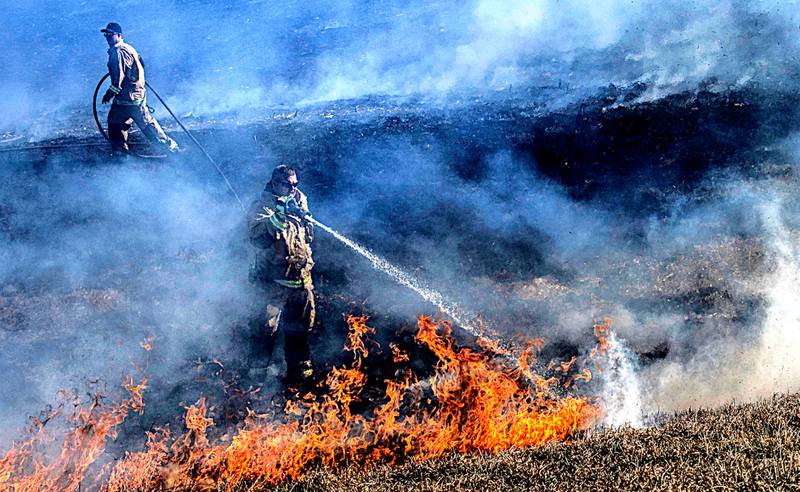 Creston Fire Department works a grass fire that got out of control at about noon Sunday south of Creston on Pole Road. With very dry conditions and steady wind from the north, what started as a half-acre grew rapidly through the corn stubble and grass waterways burning nearly 50 acres before being contained. Mutual aid from Afton and Lenox was called but Lenox was not needed.