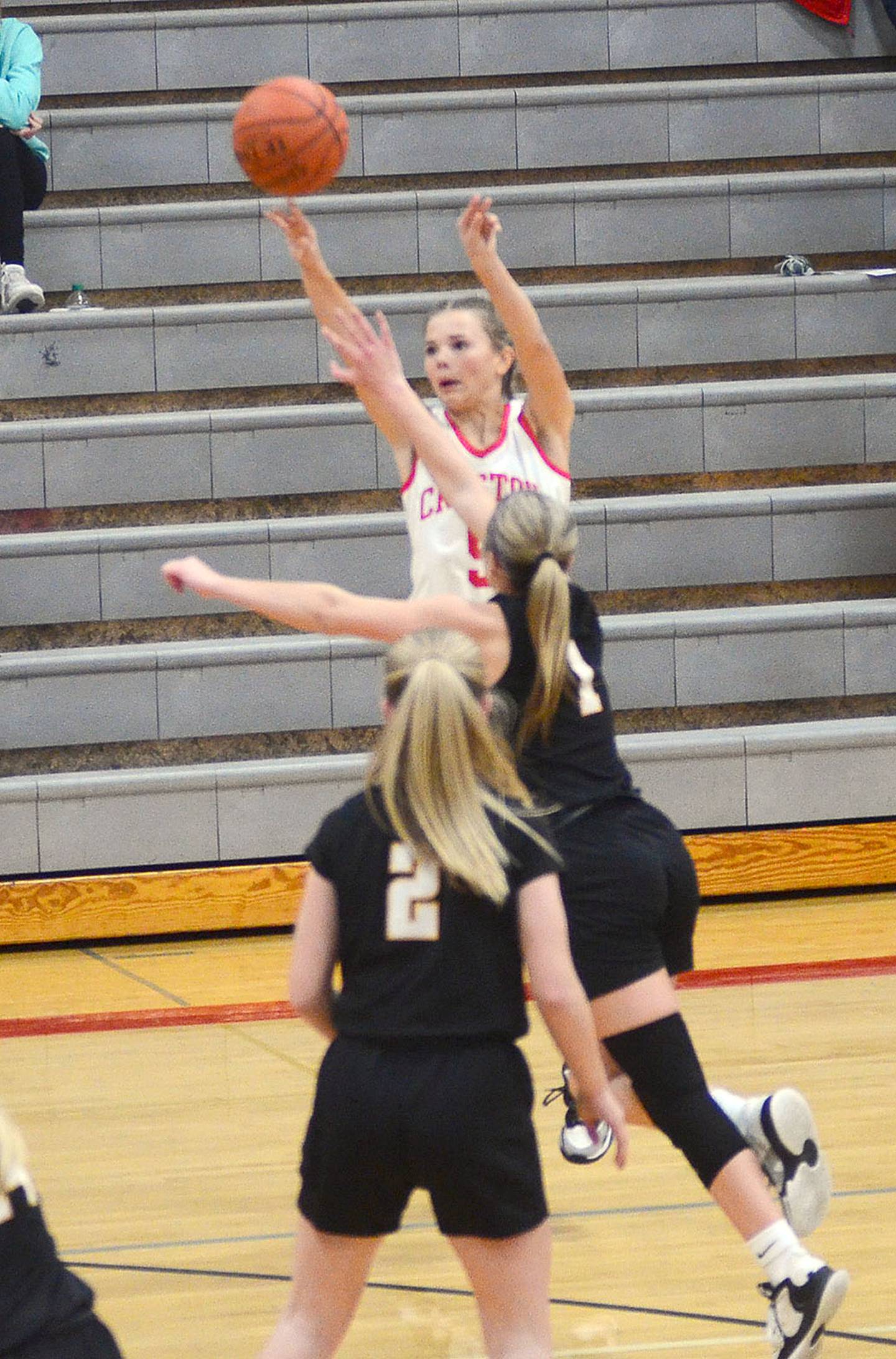 Creston's Ava Adamson launches a 3-pointer in Monday's game against Winterset. Adamson sank three 3-pointers in scoring 12 points for the Panthers.