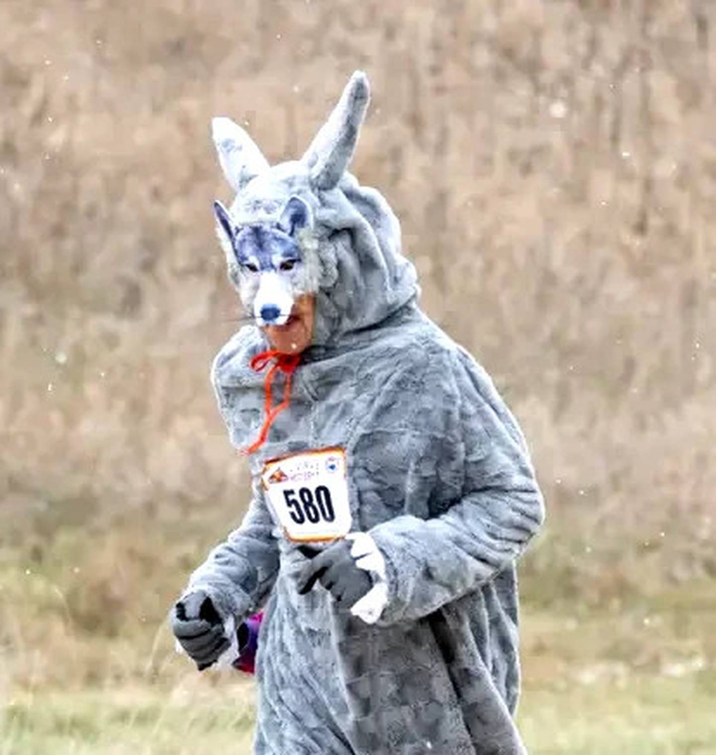 Ytzen runs in a wolf costume made by his late sister, Nancy.