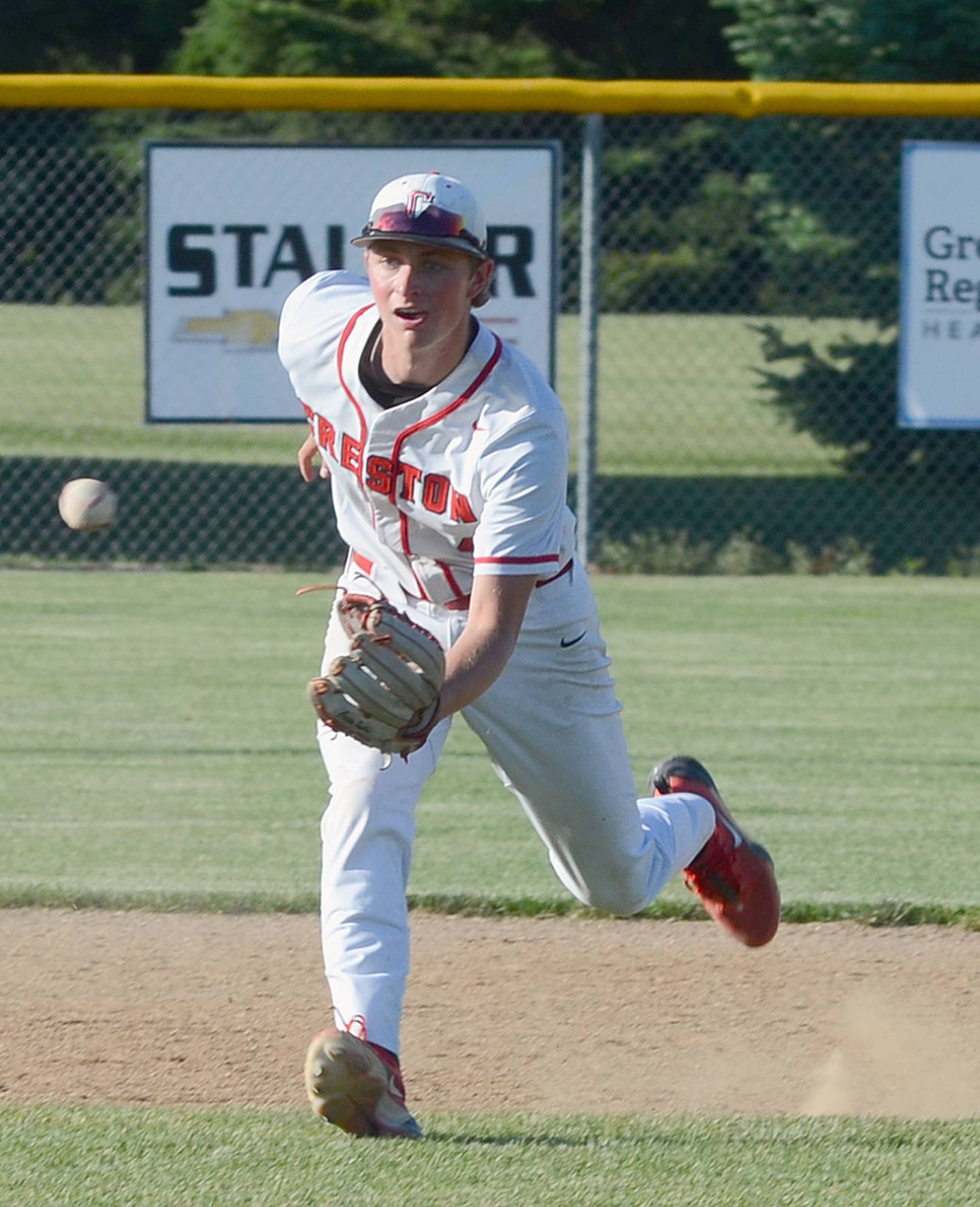 Shortstop Cael Turner charges a groundball during Creston's home doubleheader Monday against Carroll Kuemper Catholic. Turner had three hits and scored two runs in the doubleheader sweep. He pitched a four-hit shutout with 11 strikeouts in Tuesday's 9-0 win at Glenwood.