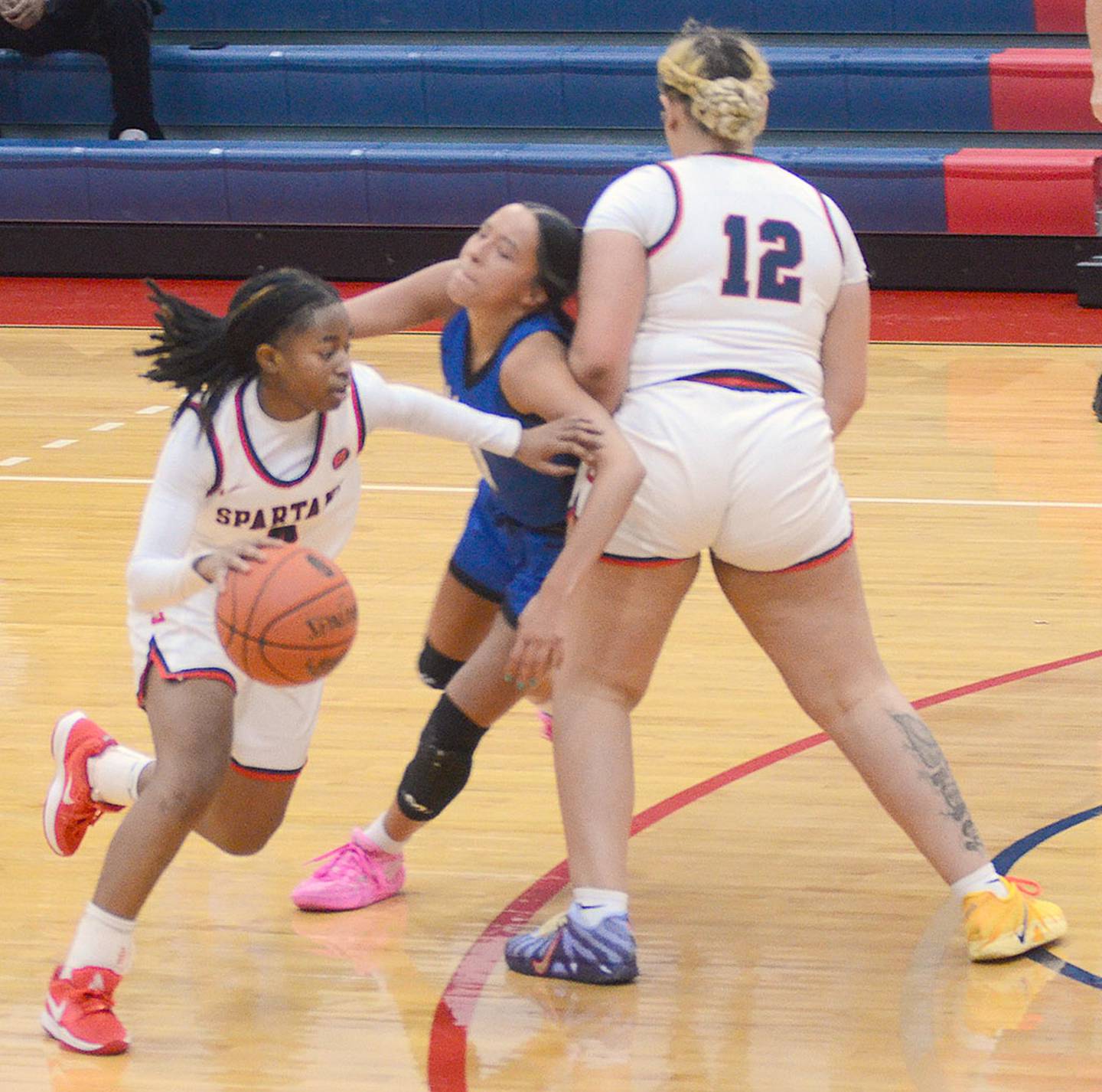 Southwestern point guard Jordyn Hall dribbles around a screen by teammate LaiLah Austin (12) against DMACC Saturday. Hall had six points and a team-high three assists.
