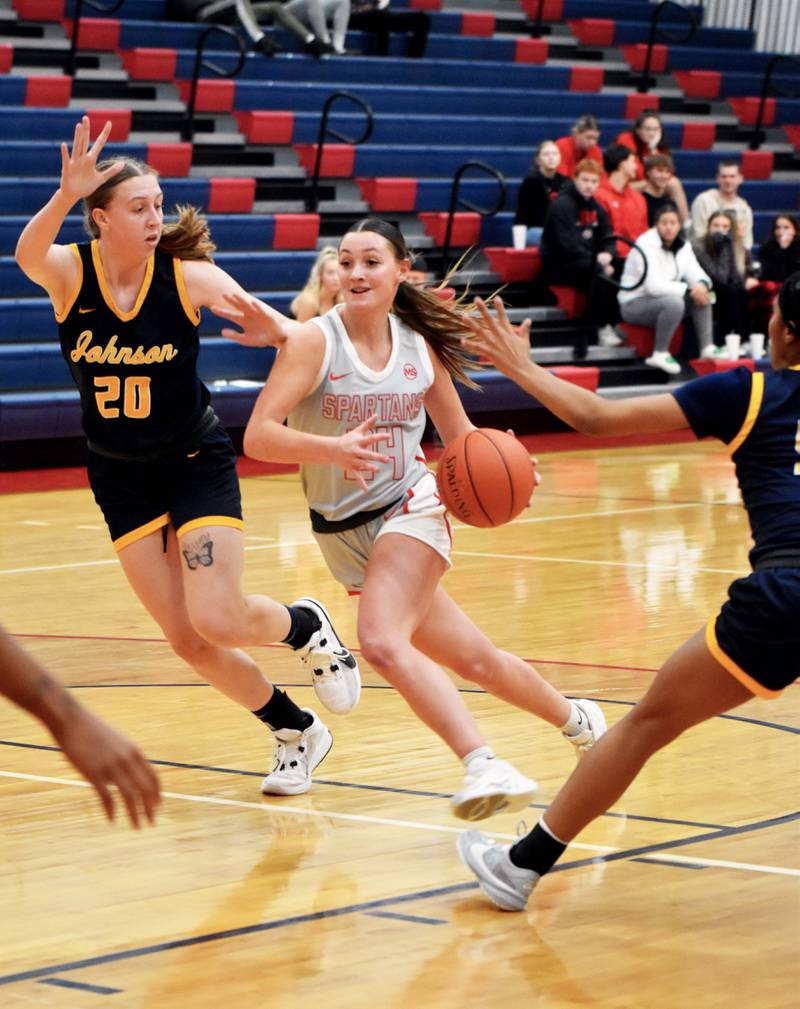 Brooklyn Hadl drives for the basket. Hadl led the Spartans in scoring with 11 points. She also had three steals and two assists.