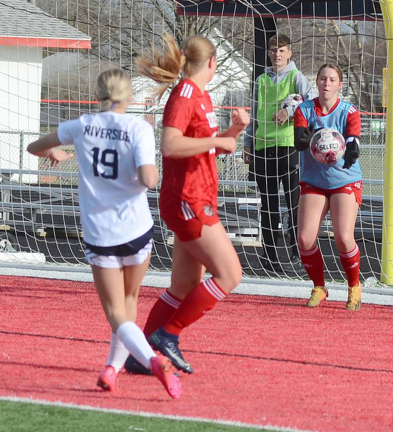 Creston/Nodaway Valley goalkeeper Lea Stonebraker catches a shot by Riverside's Myah Husz (19) during Thursday's match. Stonebraker had nine saves in the 1-1 draw, including two Riverside shots on goal in the final two minutes.