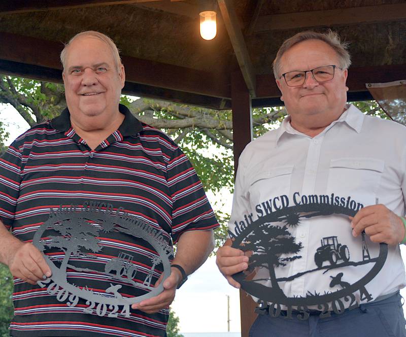 Randy Caviness (left) and Jim Frederick (right) were honored for their years of service as commissioners for the Adair Soil and Water Conservation District during the 2025 Adair County Fair.