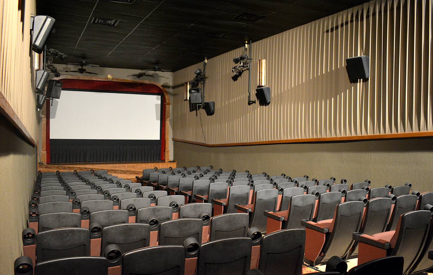 The inside of the Princess Theater, with a movable projector screen which can be wheeled back to convert the stage for live performances.