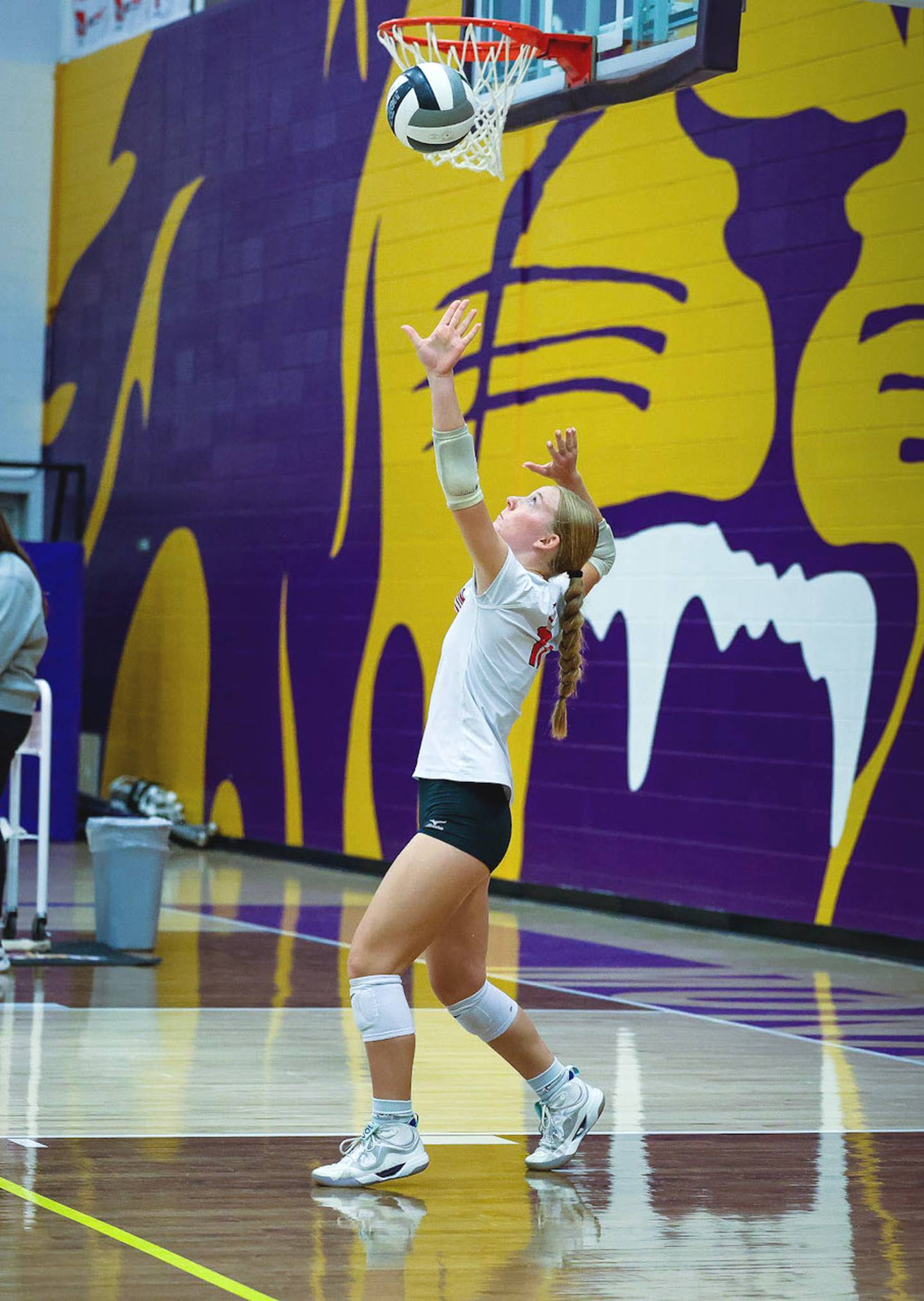 Senior libero Avery Staver puts up a serve against the Monarchs.