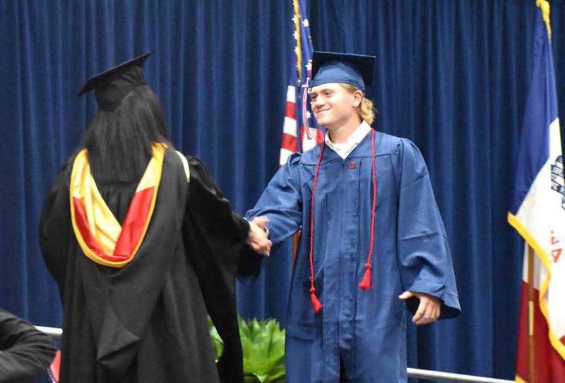 Ryan Bokelmann receives his Associate of Arts Friday during SWCC's spring commencement ceremony.
