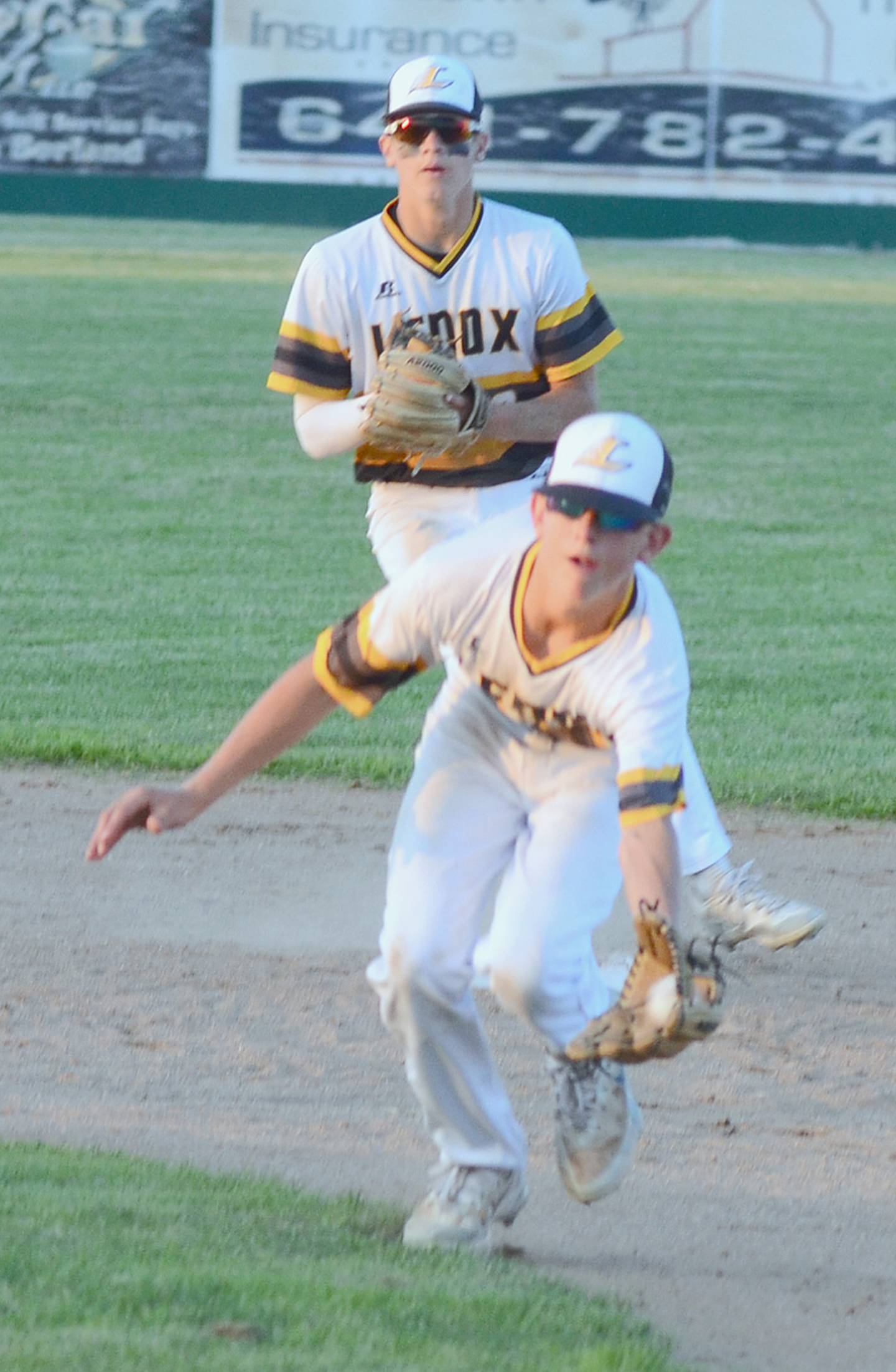 Lenox second baseman Brogan Petersen fields a ground ball for an out in the seventh inning of the Tigers' 4-0 district victory over St. Albert.