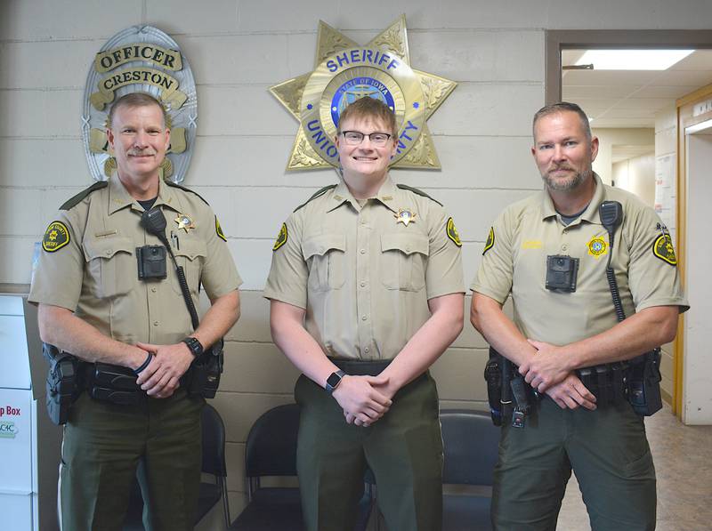 Jacob Pacholski, center, is sworn in as a deputy sheriff. Alongside him are Union County Sheriff Brian Bolton, left, and Chief Deputy Dan McNeill, right.