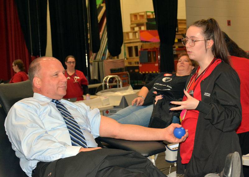 Creston Community School District Superintendent Deron Stendor donates blood during a Red Cross blood drive in 2020.