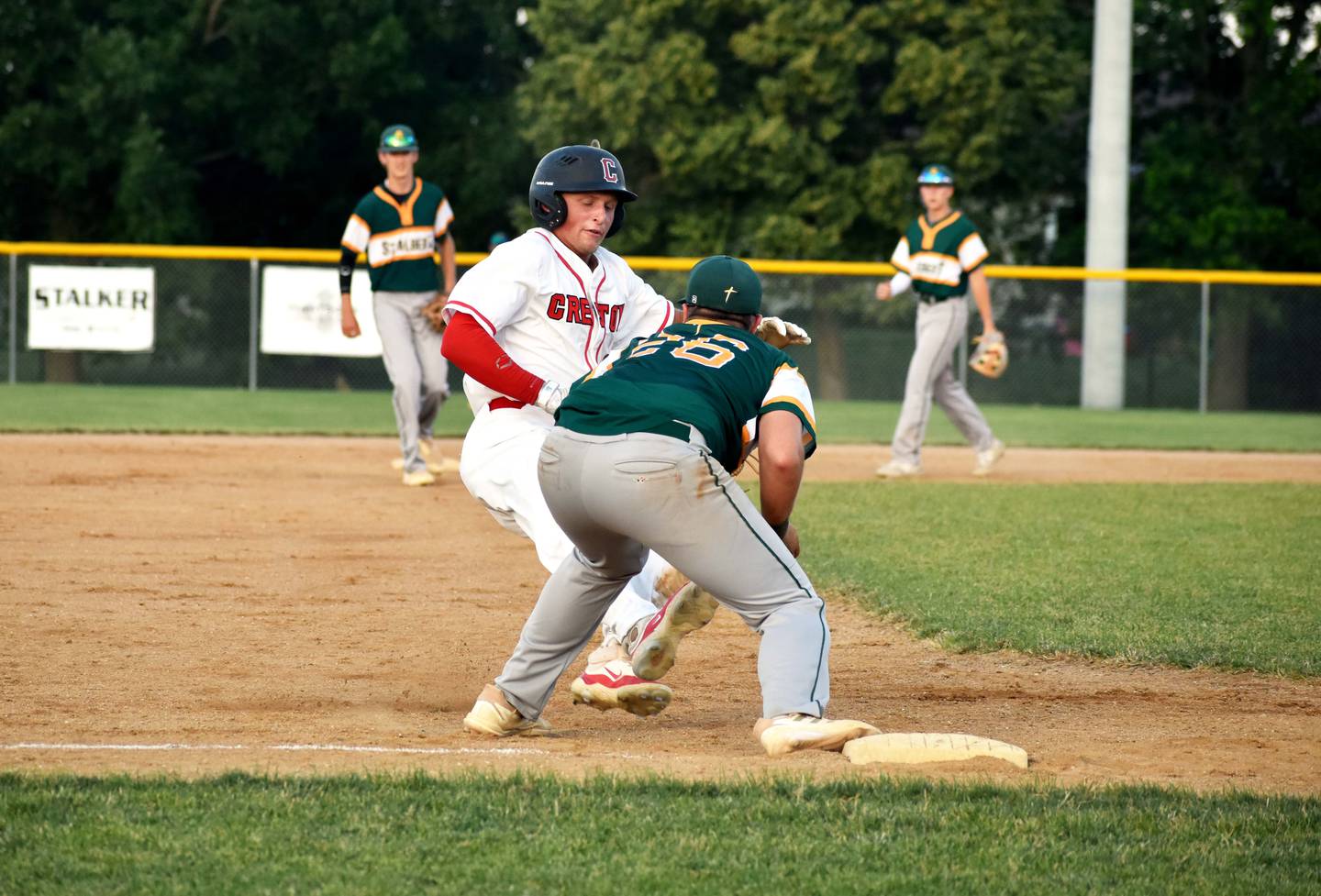 Sam Henry slides to third base.