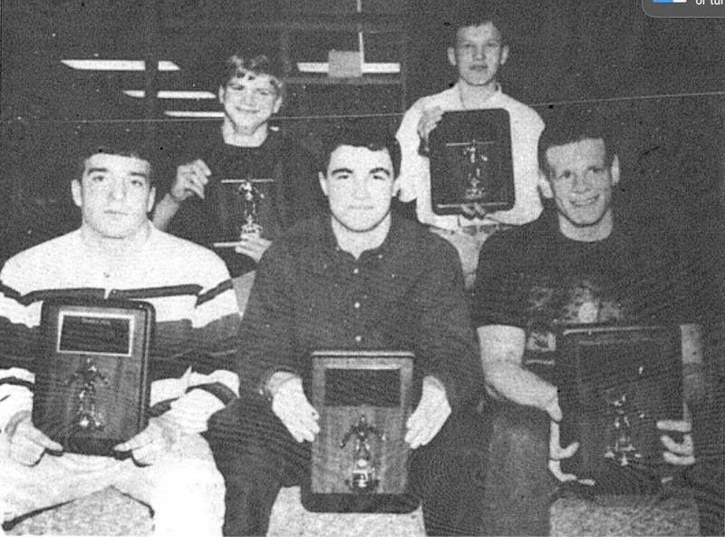 Five senior wrestlers were honored at the Creston wrestling banquet Sunday night in the high school commons. Posing with their senior plaques are front row from left: Ryan Oshel, Kasey Downing and Matt Champman. Back row: Hycin Thatcher and Doug Stevens.