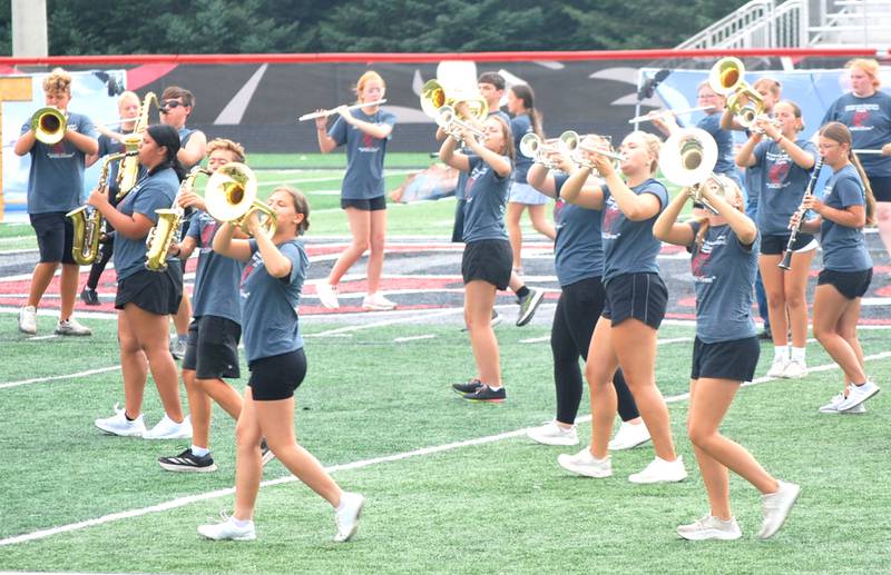The Creston Marching Band performs at a field show preview in August. The show, "Wild Horses," will feature costumes for the first time tonight.
