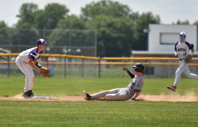 Freshman Brody Crozier slides to third Saturday in a 6-5 districts win over Stanton. Crozier brought in one of the team's runs.