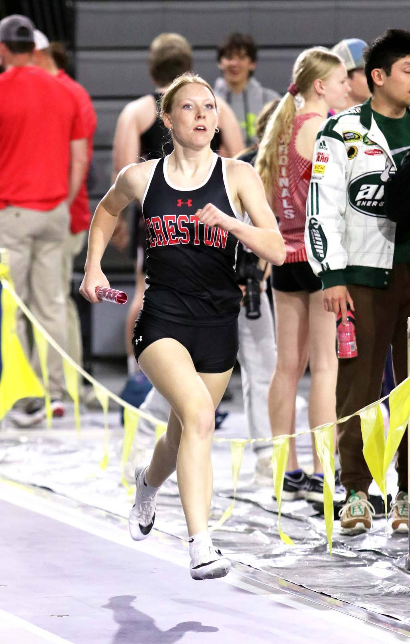 Avery Staver runs a leg in the winning girls 4x800 m relay. Also running in the relay were Payton Davis, Hope Henderson and Ella Turner.