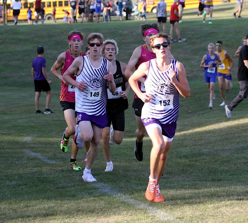 Gabe Winkelmann (right) and Luke Kading, each top-10 finishers, lead a pack of runners down the last stretch of race course on Oct. 7 at Nodaway Valley's home meet.