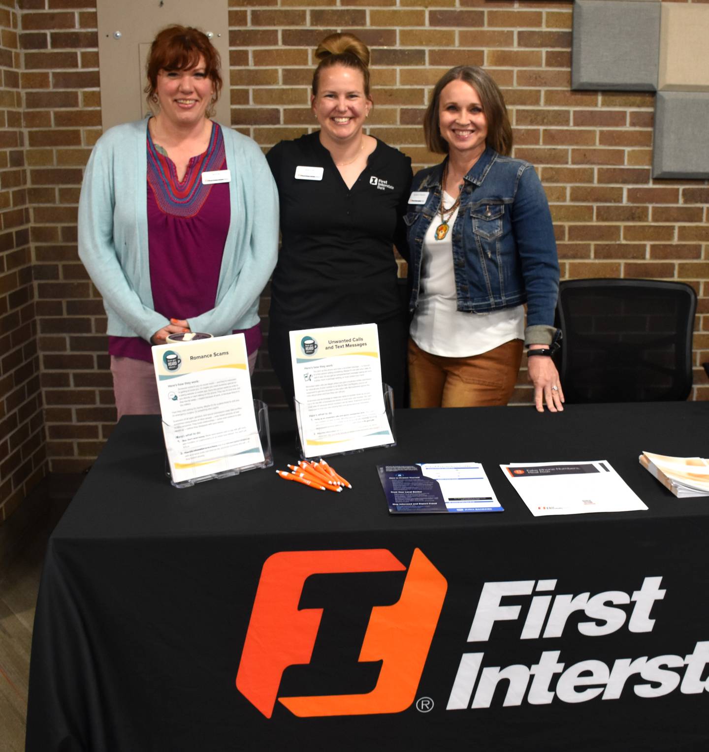 Staff from Creston's First Interstate Bank share information on fraud prevention.