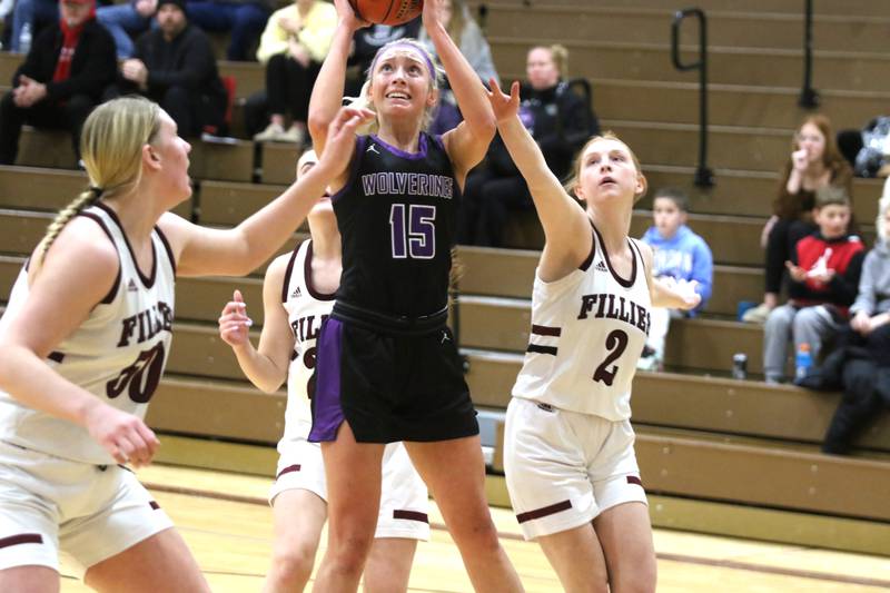 NV junior Izzy Eisbach squares up a jump shot among Shenandoah defenders in a Class 2A regional game recently.
