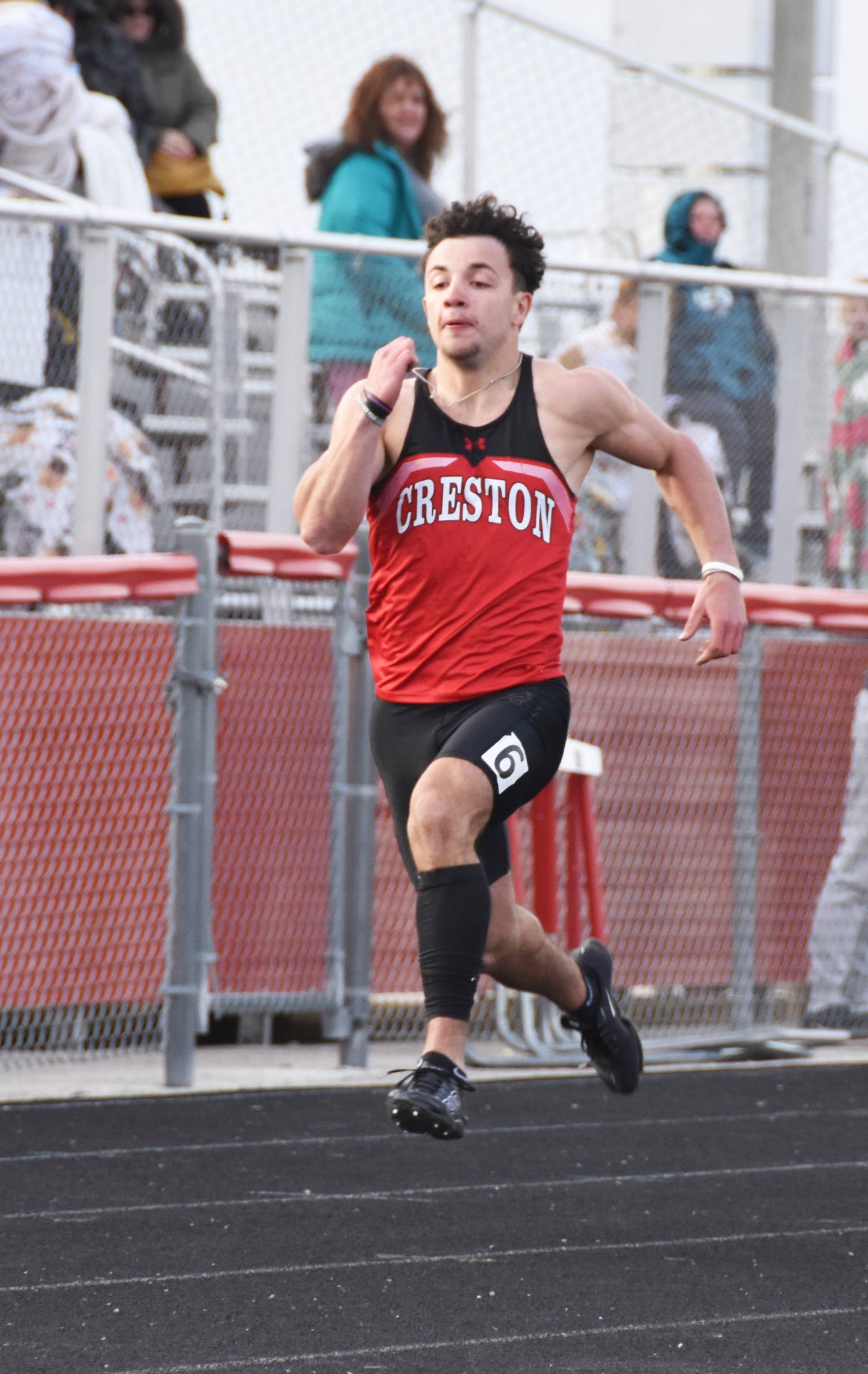 Creston junior Seth Gordon wins the boys 100m dash Monday.