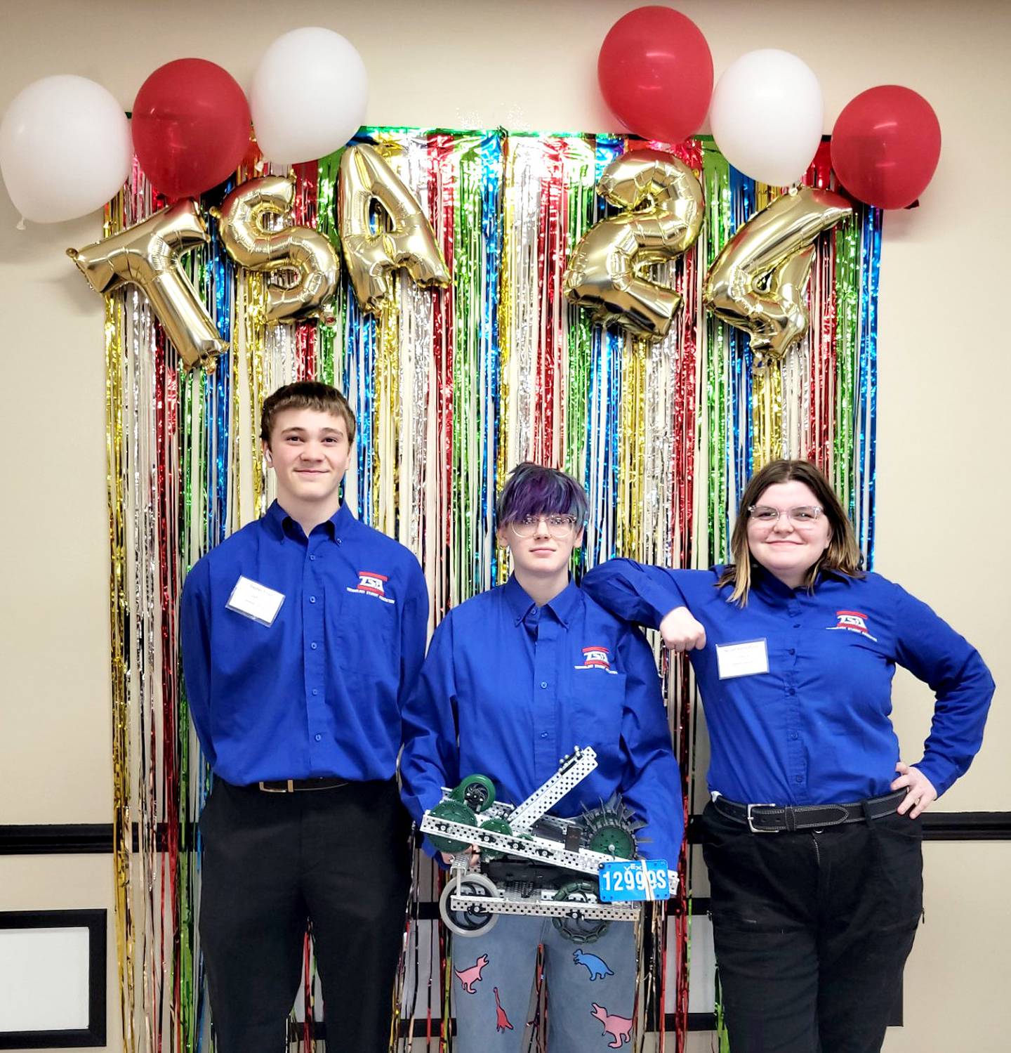 Team S poses with their robot after placing second at the State TSA and VEX Robotics contest. From left to right: Stephen Sistad, Paytin Smith, Nevaeh Kerns-Potter. Missing in this image is Jenna Orr, who is also on Team S.