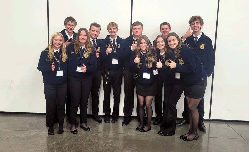East Union FFA chapter members pose with Kanyon Huntington, middle, before he is announced as national vice president.