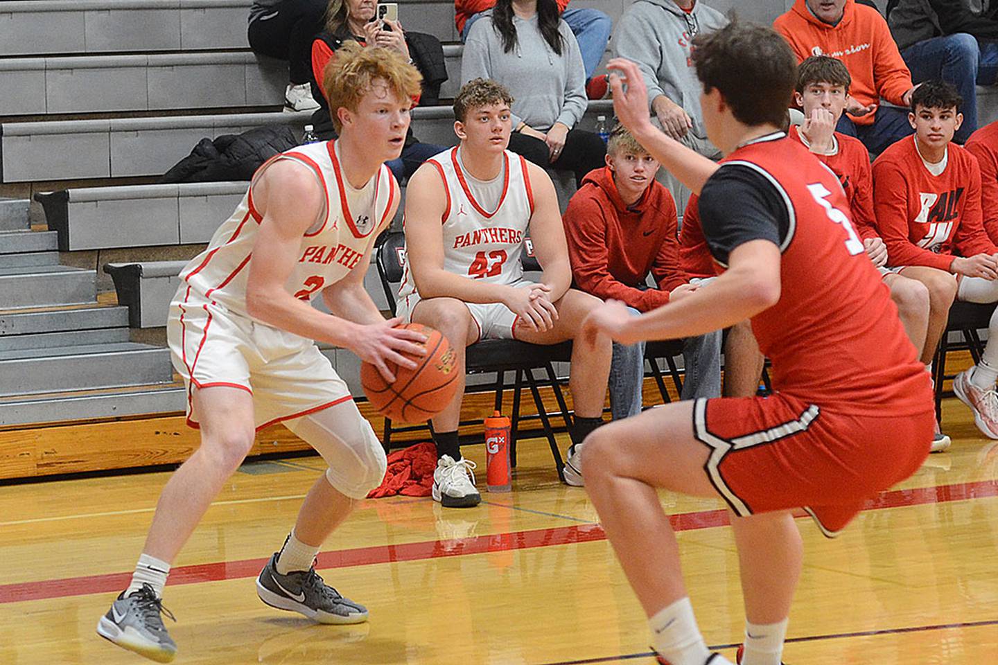 Creston sophomore Tanner Ray looks for an opening against Harlan Friday. Ray sank four 3-pointers in the first half and finished with 14 points.