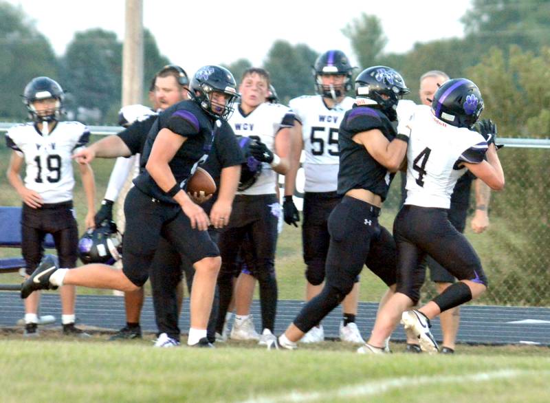 Wolverine junior tight end Caleb Christensen gets a block along the sideline from teammate Bram Dahl on a big first-half catch and run against WCV.