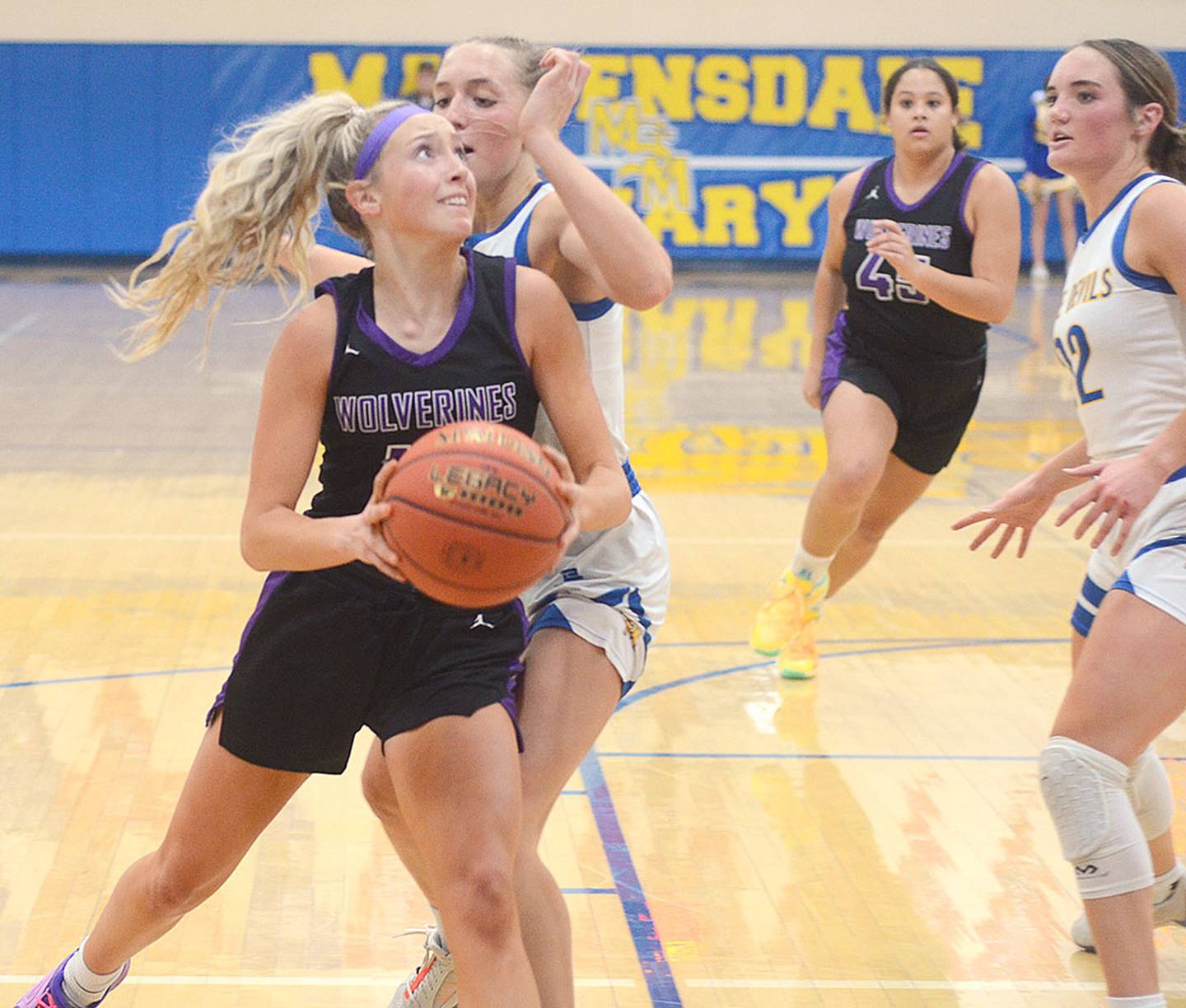 Izzy Eisbach of Nodaway Valley drives to the basket during Thursday's game at Martensdale-St. Marys. Eisbach made 4-of-7 3-pointers in scoring a game-high 29 points for the Class 2A fifth-ranked Wolverines, who were edged by the Class 1A third-ranked Blue Devils, 58-56. Sophia Shannon had 16 points and 11 rebounds for Martensdale-St. Marys, which rallied from a 32-15 halftime deficit. Lindsey Davis added 18 points and seven rebounds for the 6-1 Wolverines, who host Mount Ayr Tuesday night.