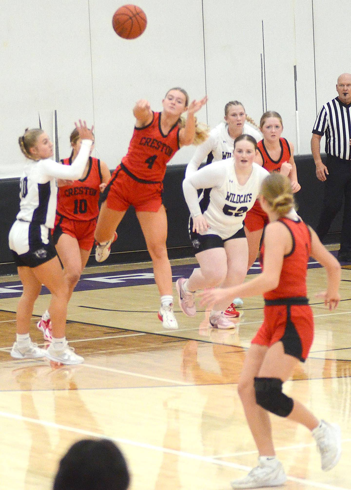 Ella Turner of Creston fires a pass downcourt to Kadley Bailey after grabbing a defensive rebound Monday. Turner had nine rebounds, six steals and nine points in the victory.