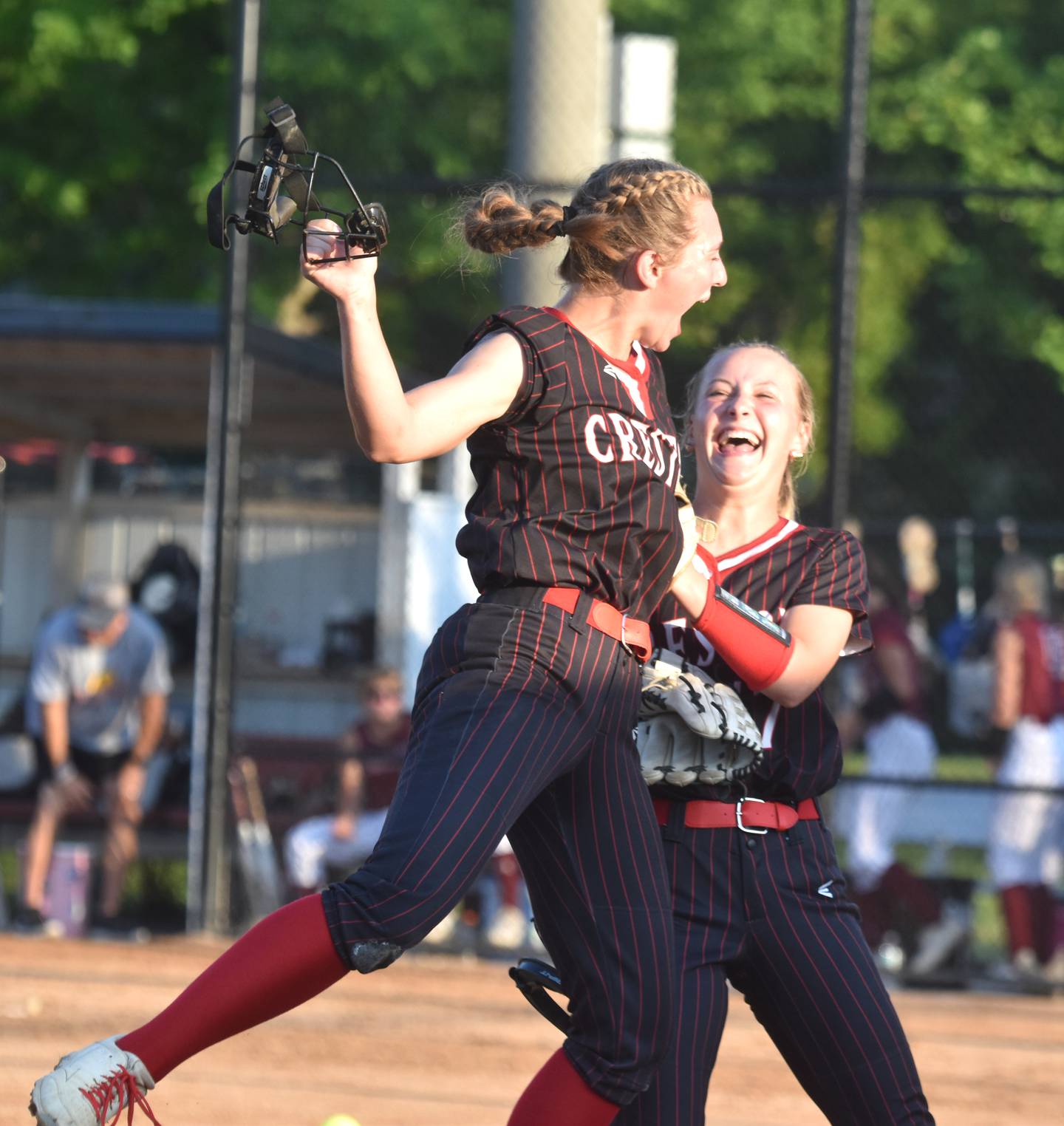 Third basemen Zoey Vandevender, left, celebrates with pitcher Taryn Fredrickson after a strikeout ended the inning without allowing any runs.