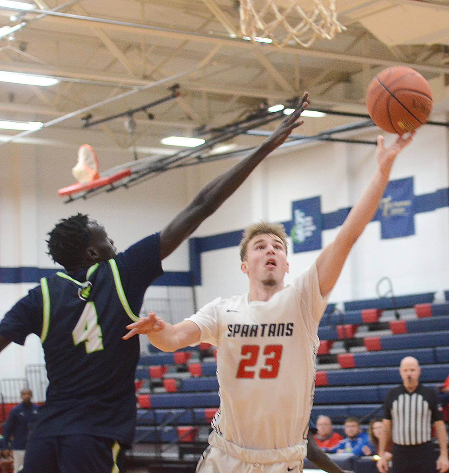 Bogdan Cret of Southwestern (23) finishes a layup against Western Iowa Tech Wednesday. Cret had four points, four assists and three steals in the 75-66 victory.