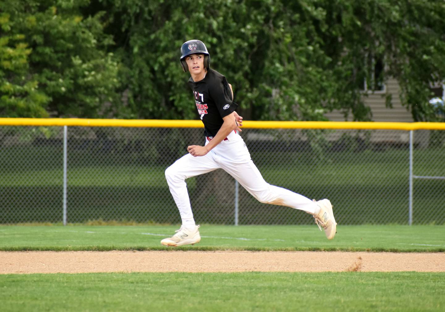 Senior Gavin Millslagle watches a bunt by Tanner Ray as he runs to second in game one against the Monarchs.