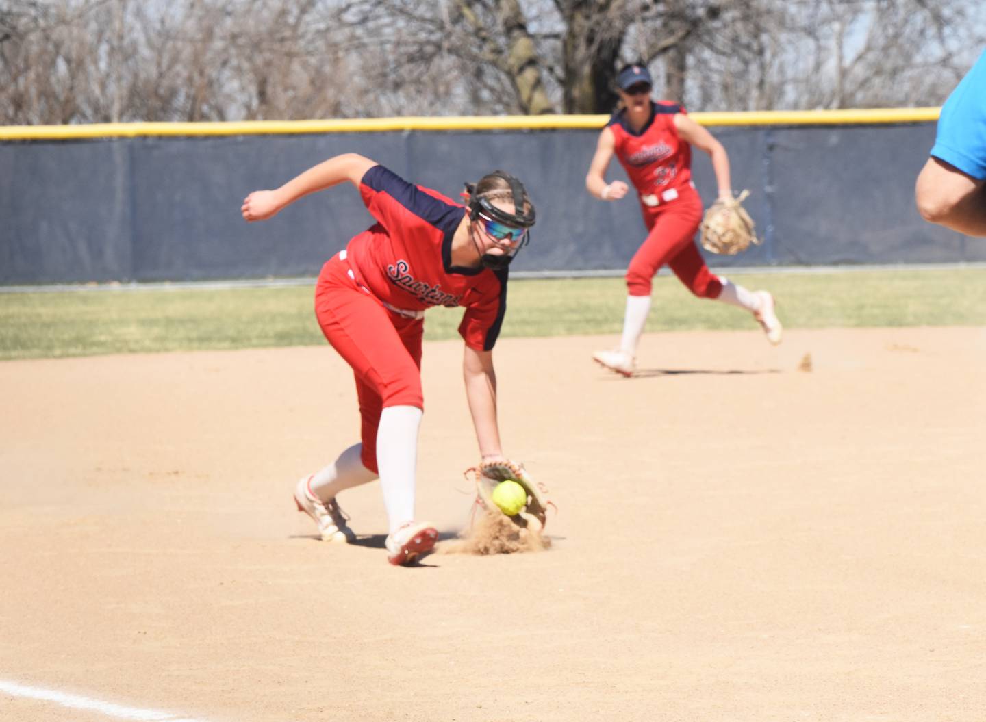 Third baseman Joslyn Policky scoops a ground ball against the Reivers. Policky had three RBIs in game one.