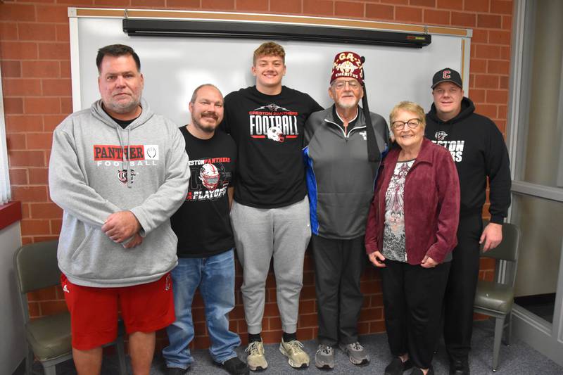 Creston senior lineman Brayden Schoon, center, has been selected to play in the 2025 Iowa Shrine Bowl All-Star Classic on July 19. From left, coach Brian Morrison, uncle Jeff Schoon, Brayden Schoon, shriner Jerry Hoffman, wife Ellie Hoffman and dad Jeremy Schoon.