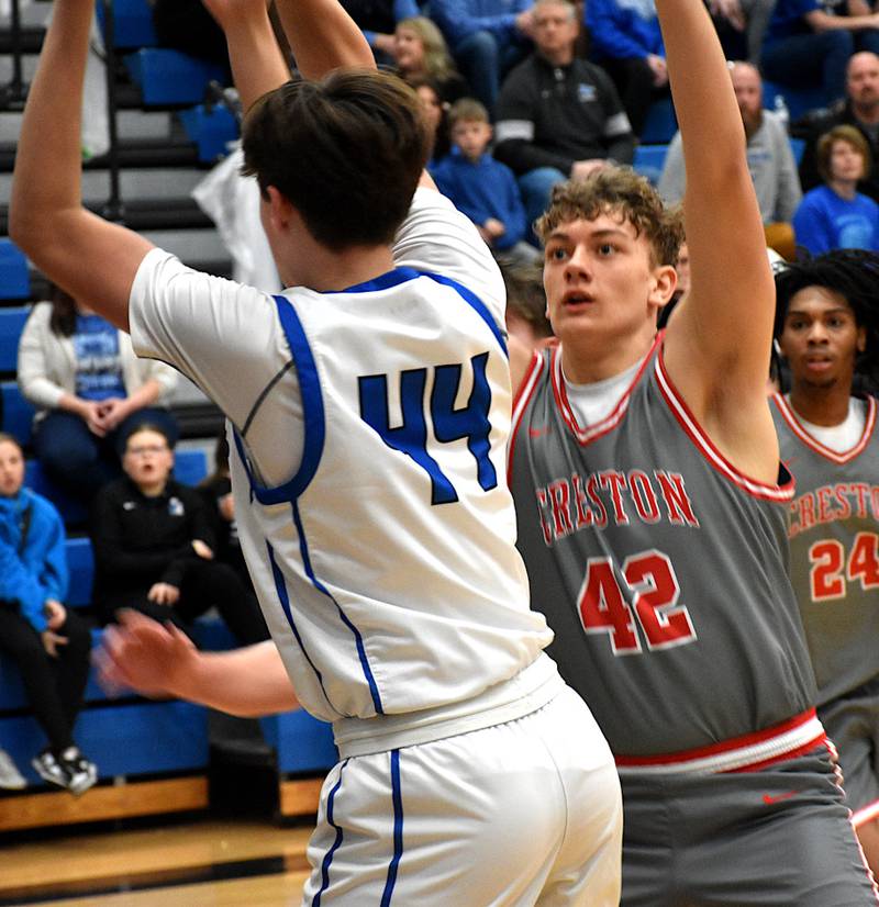 Creston’s Brayden Schoon defends Bondurant-Farrar’s Drake Pfaltzgraff Thursday during Bondurant-Farrar’s win ending the Panthers season. Panther Tony Davidson watches.