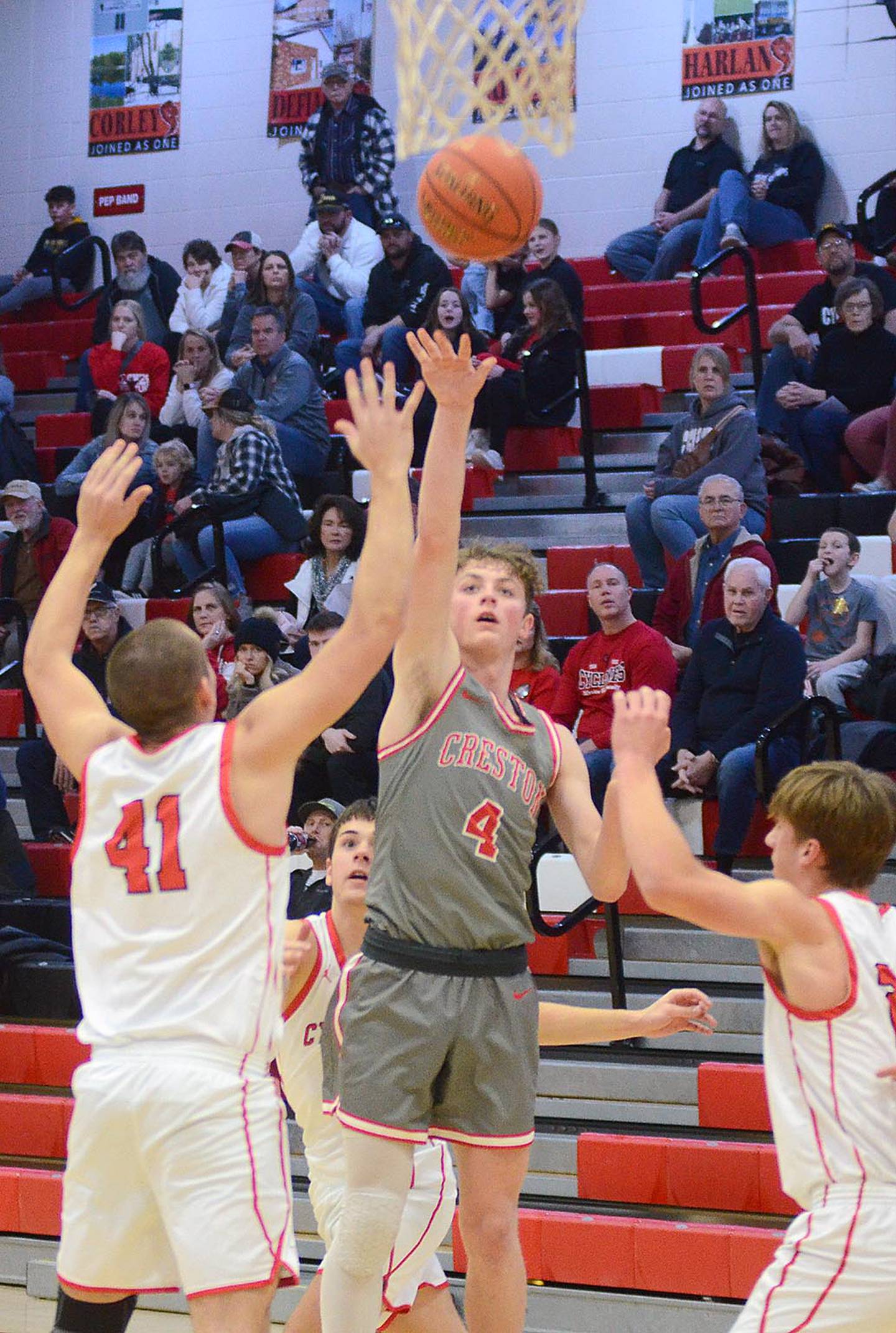 Creston senior guard splits two Harlan defenders for a shot near the lane in Monday's substate win at Harlan. Turner had 13 points, five steals and five rebounds.