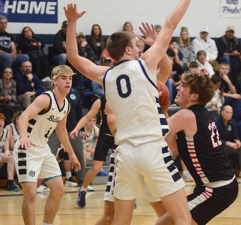 Mount Ayr's Tate Dugan looks to score inside against Hayden Riedel of Bedford (0) during Thursday's game. Dugan scored 10 points in the 45-34 loss.