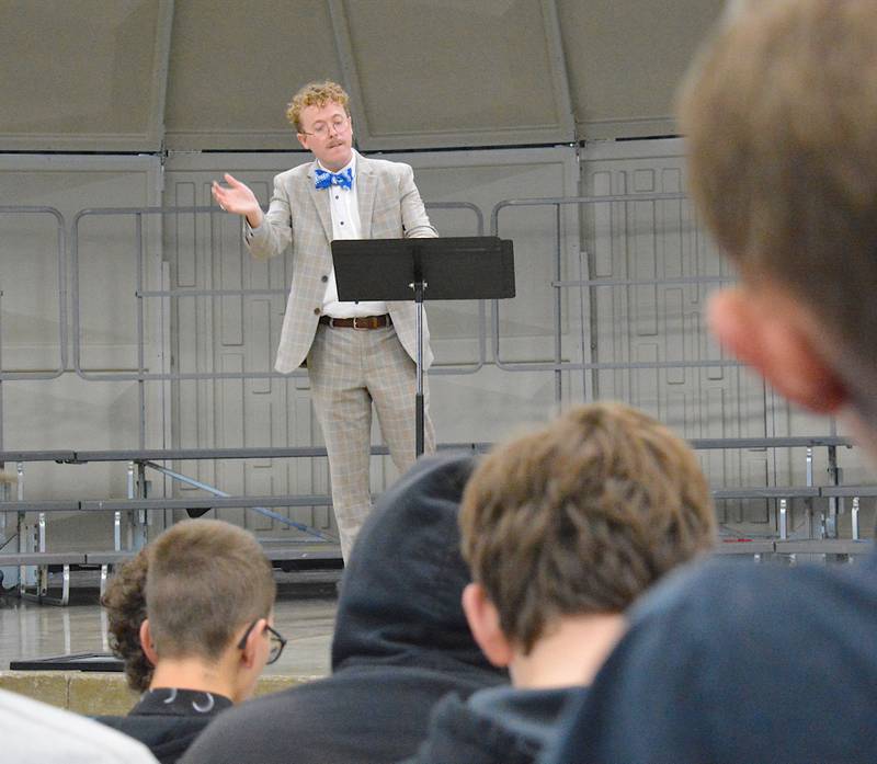 Taylor Mayne conducts while practicing with the Pride of Iowa Conference Honor Choir.