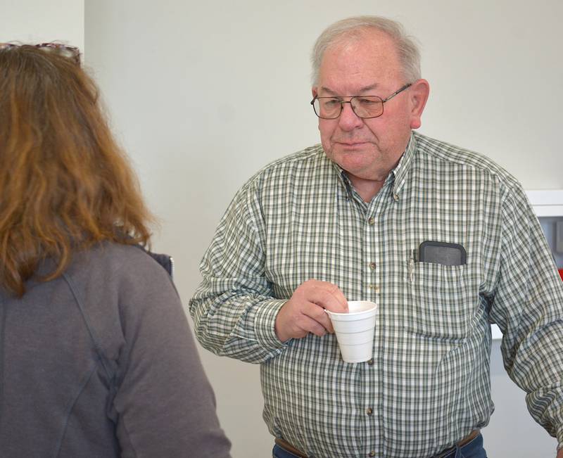 State Senator Tom Shipley listens to an attendee of Saturday's legislative coffee session.